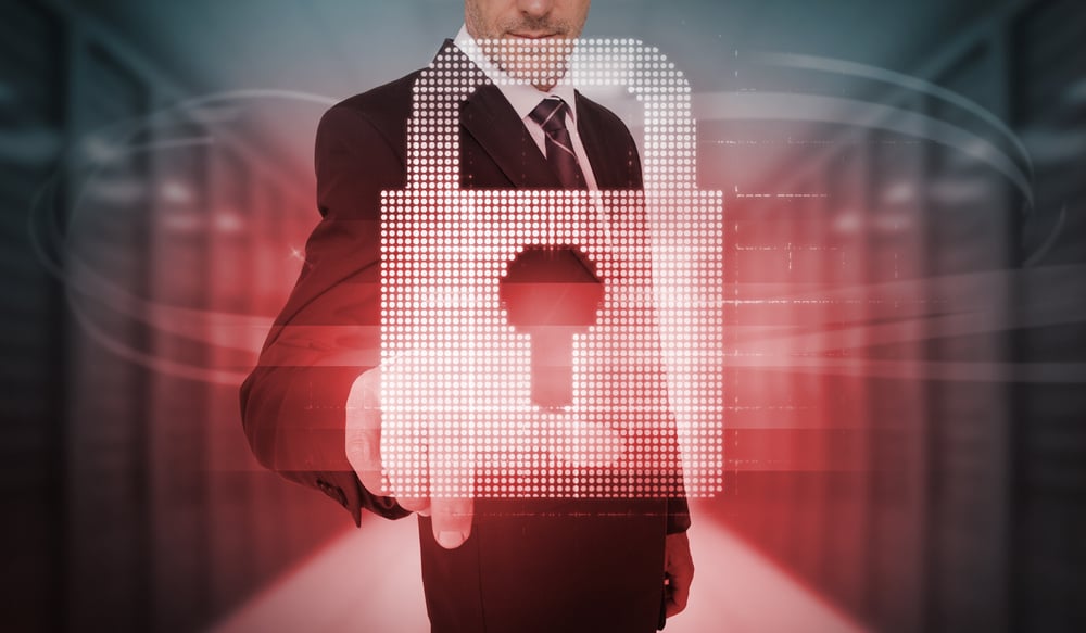 Businessman touching futuristic red lock touchscreen in data center